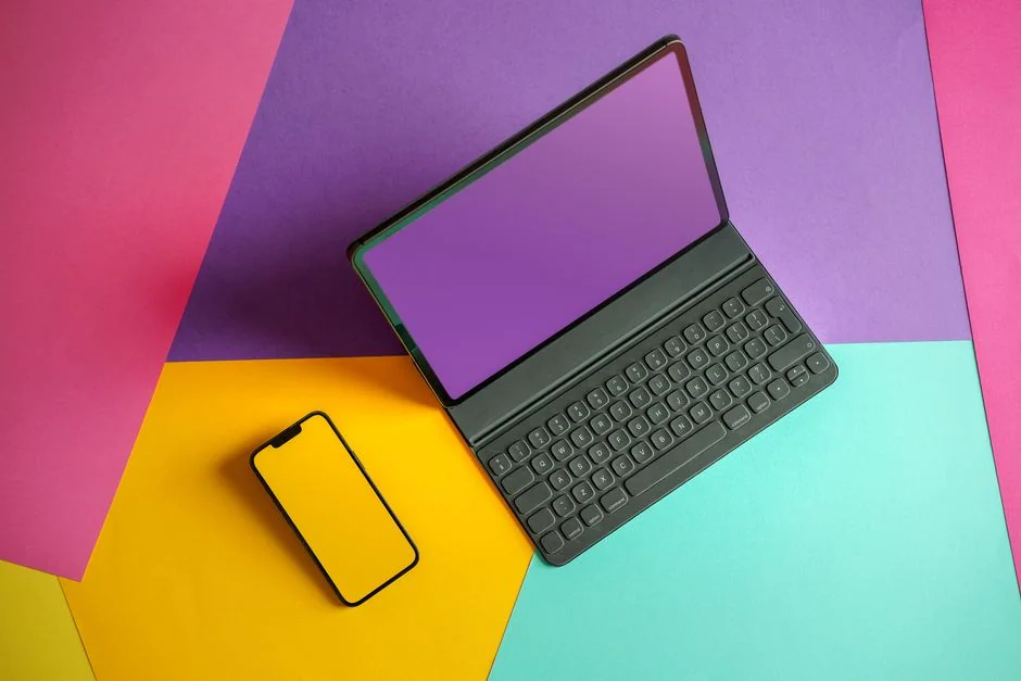 Modern laptop displaying a checkout form against a minimalist beige backdrop.